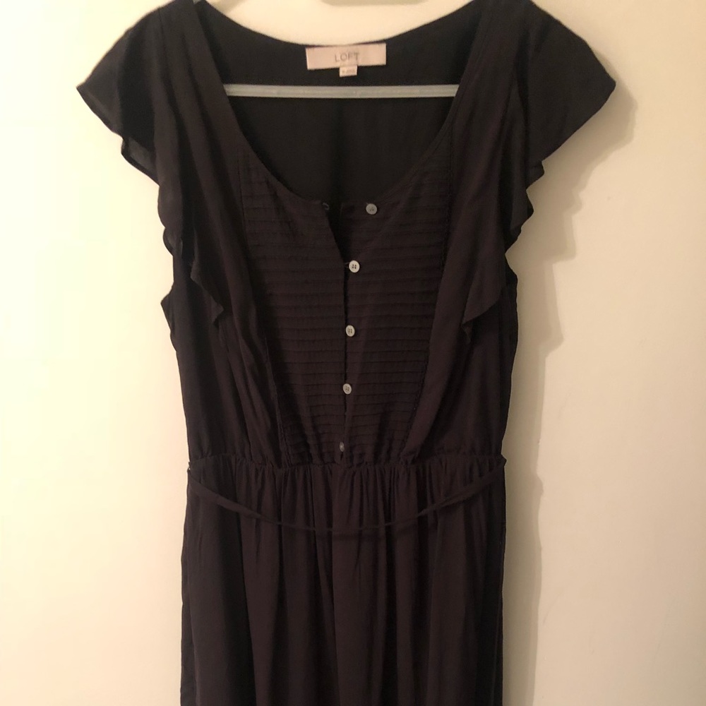 Black knee length dress.
